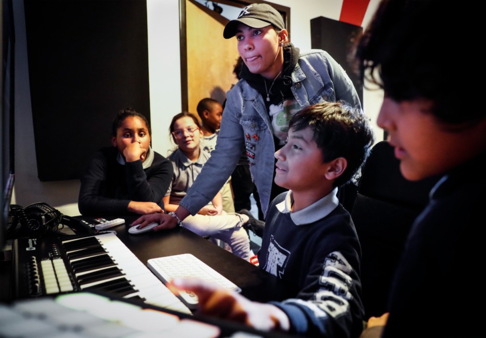 <strong>Studio instructor Diamonique Vidro (middle) creates beats with Boys &amp; Girls Clubs after school students on Wednesday, October 19, 2022, in the recording studio that Notes for Notes provided. The studio recently re-opened after it closed back in 2020 due to the pandemic.</strong> (Mark Weber/The Daily Memphian)
