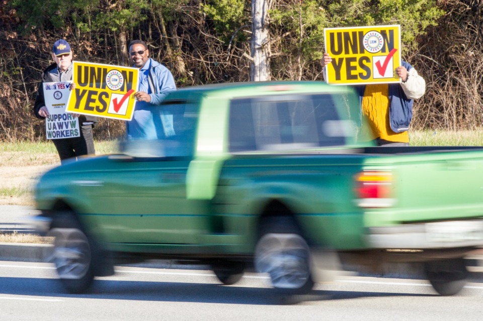 <strong>Union supporters hold up signs near the Volkswagen plant in Chattanooga, Tenn., on Friday, Dec. 4, 2015. Skilled-trades workers at the plant were voting on whether to be represented by the United Auto Workers for collective bargaining purposes.</strong> (Erik Schelzig/AP)