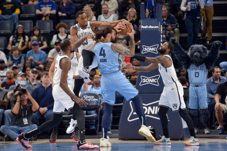 <strong>Memphis Grizzlies center Steven Adams (4) battles Brooklyn Nets forward Nic Claxton (33), guard Kyrie Irving, right, and forward Kevin Durant, front left, on Oct. 24, 2022.</strong> (Brandon Dill/AP)