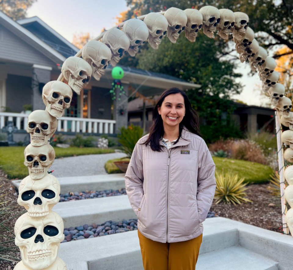 <strong>Sydney Sep&uacute;lveda poses in front of a skeleton arch at 419 N. Willett St.&nbsp;</strong>(Photo courtesy Jacob Juliot)
