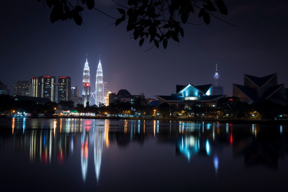 <strong>Malaysia's landmark buildings, from left to right, Petronas Twin Towers, National Art Gallery, Kuala Lumpur Tower illuminate the night skyline in Kuala Lumpur, Malaysia, Monday, April 6, 2015.</strong> (AP Photo/Joshua Paul)