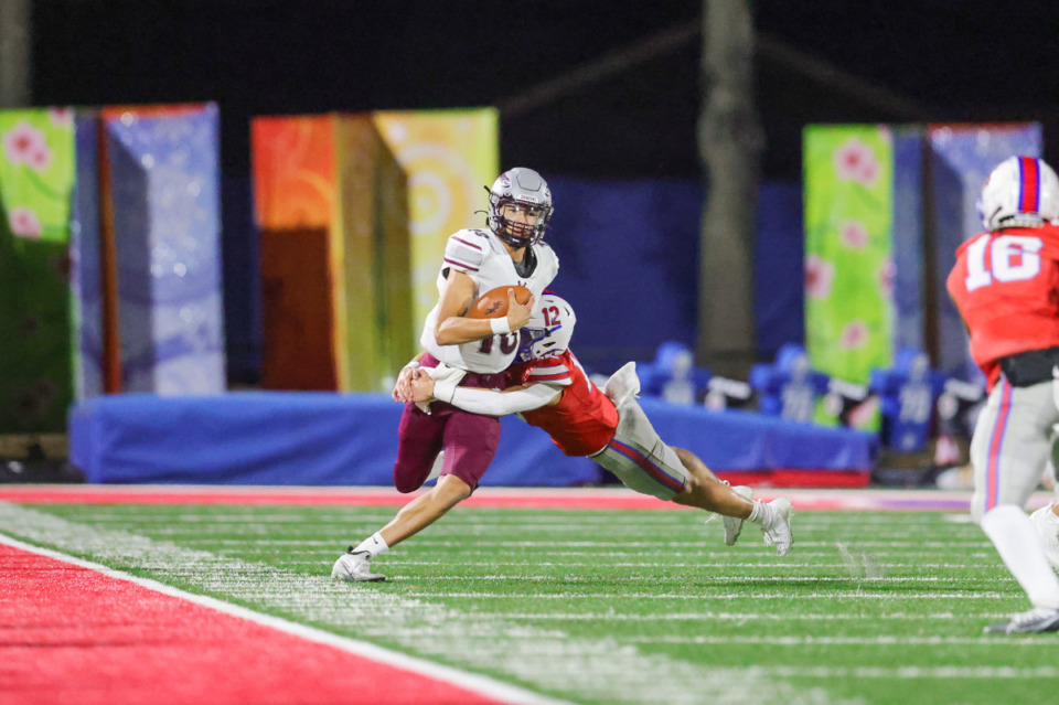 <strong>Bartlett&rsquo;s Parker Moore (12) tackles Collierville&rsquo;s Aidan Glover (10) on Oct. 21, 2022. Bartlett and Collierville have several players among the statistical leaders.</strong> (Ryan Beatty/Special to The Daily Memphian)