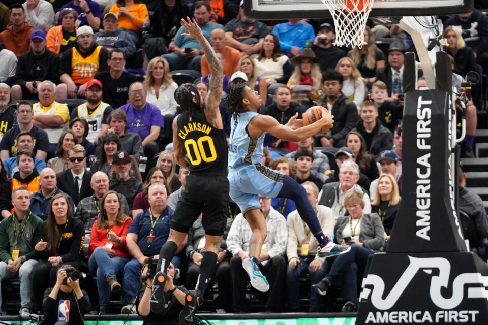 <strong>Memphis Grizzlies guard Kennedy Chandler (1) goes to the basket as Utah Jazz guard Jordan Clarkson (00) tries to block on Oct. 31, 2022, in Salt Lake City.</strong> (Rick Bowmer/AP)
