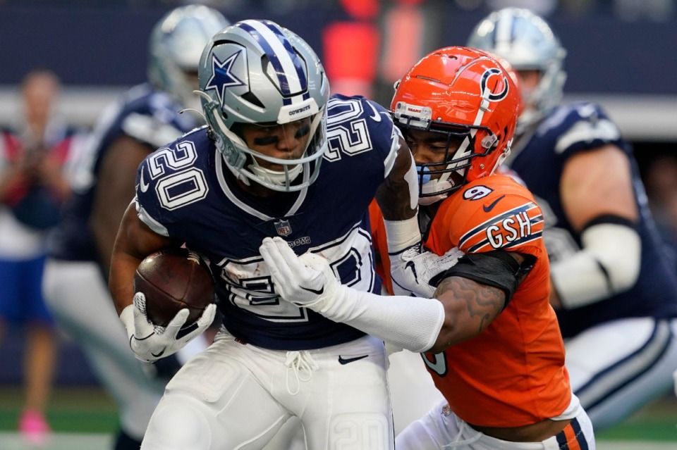 <strong>Dallas Cowboys running back Tony Pollard, left, is tackled by Chicago Bears safety Jaquan Brisker during the second half of an NFL football game, Sunday, Oct. 30, 2022, in Arlington, Texas. The Cowboys won 49-29.</strong> (AP Photo/Nam Y. Huh)