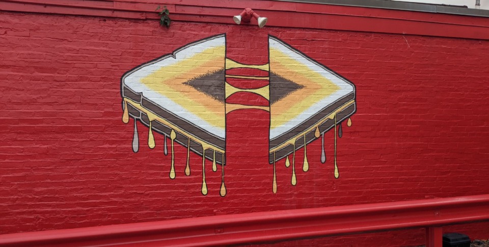 <strong>A grilled cheese mural is painted outside Cheesy Corner in the former site of Ferraro's Pizza at 111 Jackson Ave. in the Pinch District.</strong> (Neil Strebig/The Daily Memphian)