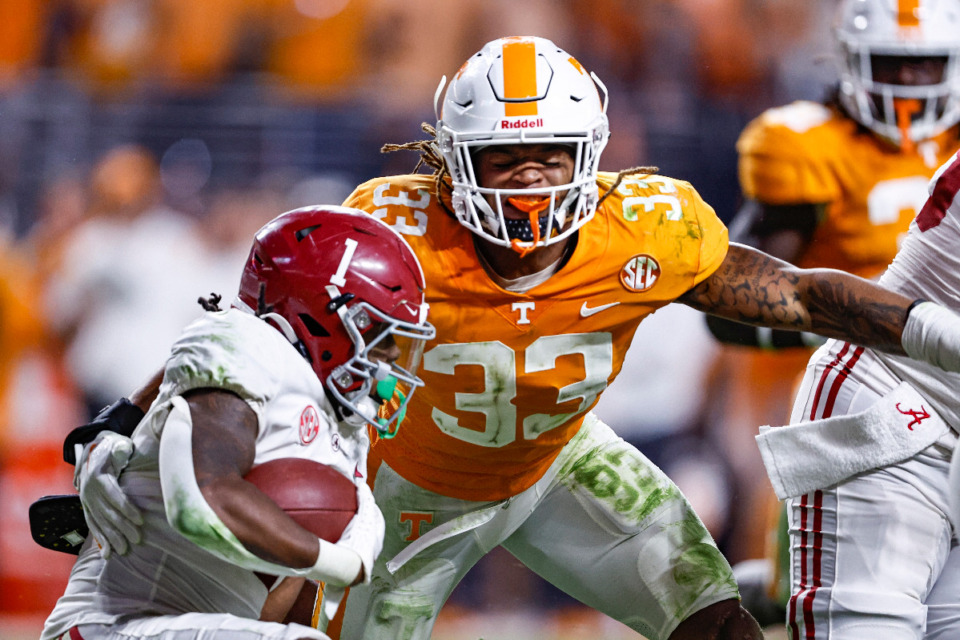 <strong>Tennessee linebacker Jeremy Banks (33) from Cordova High School and his Volunteer teammates are ranked No. 1 in the first College Football Playoff rankings announced Tuesday, Nov 1.</strong> (Wade Payne/AP file)