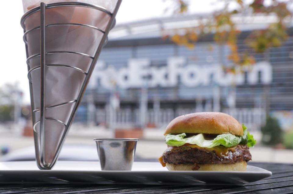 <strong>A burger and fries sits on the patio of Penny's Nitty Gritty overlooking the FedExForum on Nov. 1, 2022.</strong> (Patrick Lantrip/The Daily Memphian)