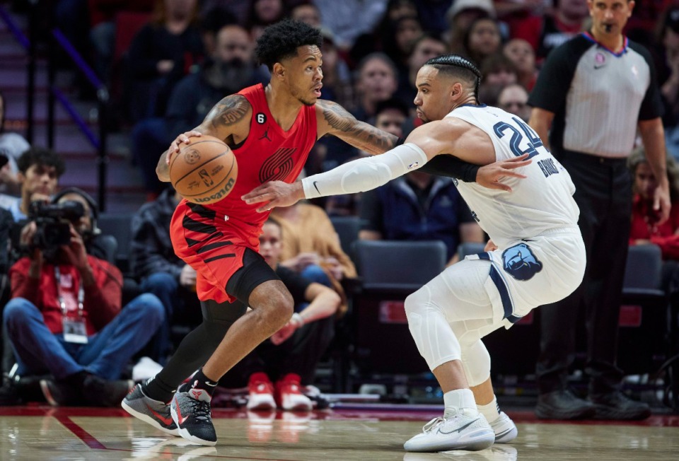 <strong>Grizzlies forward Dillon Brooks, right, guards Portland Trail Blazers guard Anfernee Simons in Portland, Oregon, on Nov. 2, 2022.</strong> (Craig Mitchelldyer/AP)