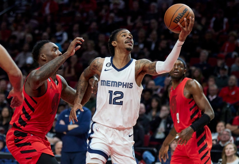 <strong>Memphis Grizzlies guard Ja Morant (12) shoots in front of Portland Trail Blazers forward Nassir Little, left, on Wednesday, Nov. 2, 2022, in Portland, Oregon.</strong> (Craig Mitchelldyer/AP)