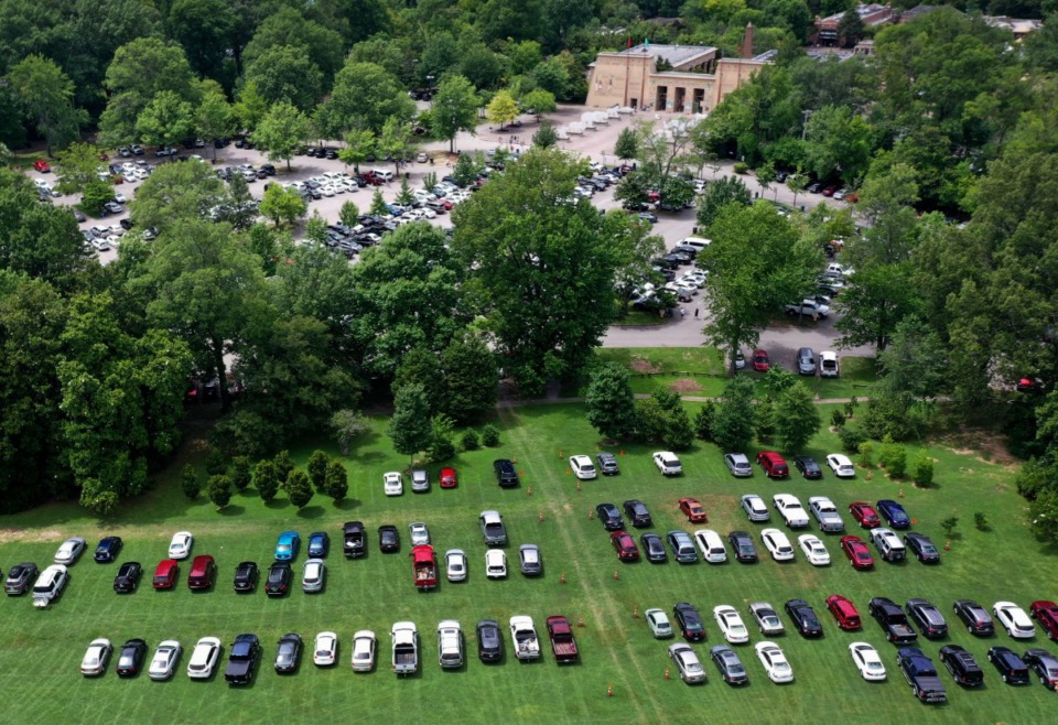 <strong>Overflow parking for the Memphis Zoo spills onto the Greensward at Overton Park on July 6, 2019. The city will move out of a maintenance&nbsp;facility on East Parkway and split the available land between the Memphis Zoo and Overton Park Conservancy.</strong> (Jim Weber/Daily Memphian)