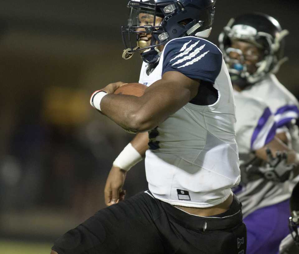 <strong> Kirby&rsquo;s Laclavin Wilson turns the corner and tries to find a little running room as he nears the goal line in the second quarter during Friday&rsquo;s action at Southwind.</strong> (Dale L. Anderson/Daily Memphian)