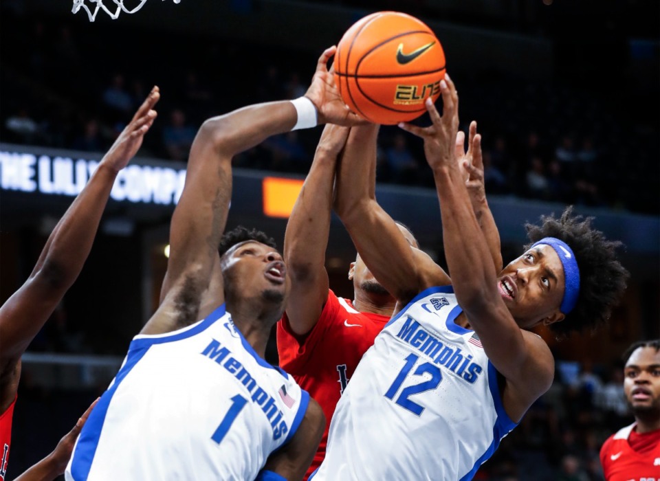 <strong>Memphis Tigers teammates Keonte Kennedy (left) and DeAndre Williams (right) fight for a rebound against Lane College during action on Sunday, October 30, 2022</strong>. (Mark Weber/The Daily Memphian)