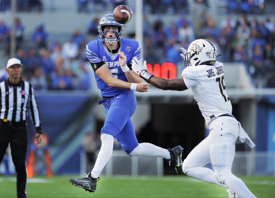 <strong>University of Memphis quarterback rolls out of the pocket during a Nov. 5, 2022 game against UCF.</strong> (Patrick Lantrip/The Daily Memphian)