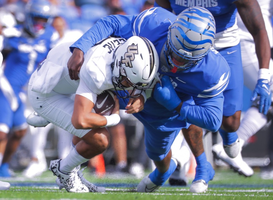 <strong>UCF quarterback Mikey Keene (13) gets sacked during a Nov. 5, 2022 game against the University of Memphis.</strong> (Patrick Lantrip/The Daily Memphian)