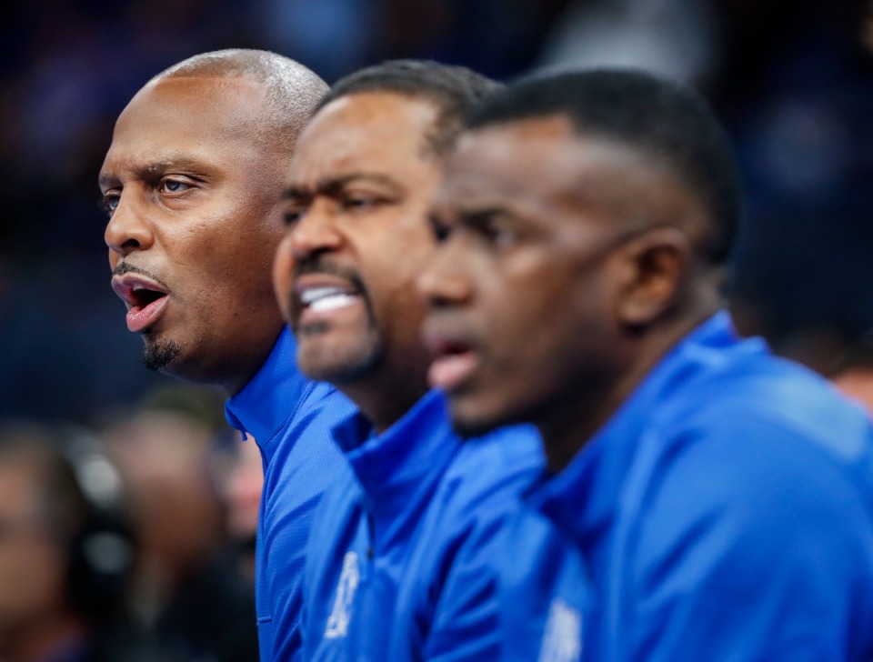 <strong>Faragi Phillips (right), with Memphis Tigers head coach Penny Hardaway (left) and assistant coach Frank Haith watch the action against Lane College on Sunday, Oct. 30, 2022 at FedExForum.</strong> (Mark Weber/The Daily Memphian)