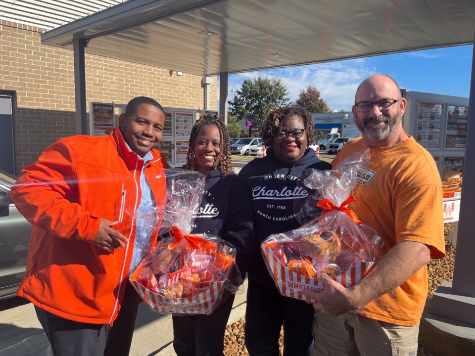 <strong>(left) Whataburger operating partner Cedric Joyner, Whataburger first in line winners (middle)&nbsp;Danyel Bonds, Sherrie Taylor&nbsp;and Jim Lord outside Whataburger in Cordova on Monday, Nov. 14.</strong> (Courtney Vick)