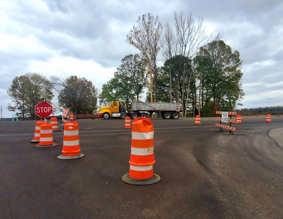 <strong>Workers hauled materials onto Holly Springs Road to put the finishing touches on a $37 million fix for the roadway&rsquo;s repeated flash-flooding.</strong> (Toni Lepeska/The Daily Memphian)