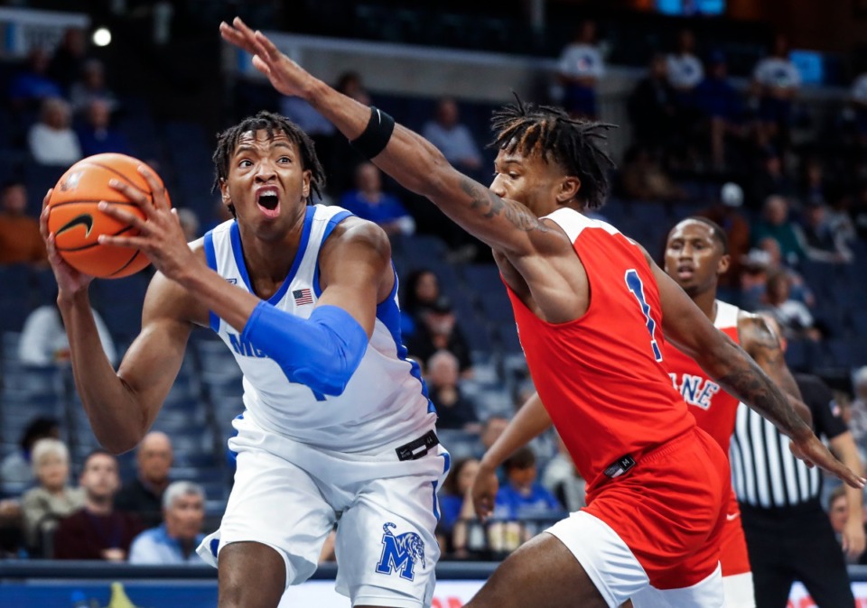 <strong>Memphis Tigers forward Chandler Lawson (left) drives the lane against Lane College defender Kelvin Allen (right) during action on Sunday, Oct. 30, 2022.</strong> (Mark Weber/The Daily Memphian)