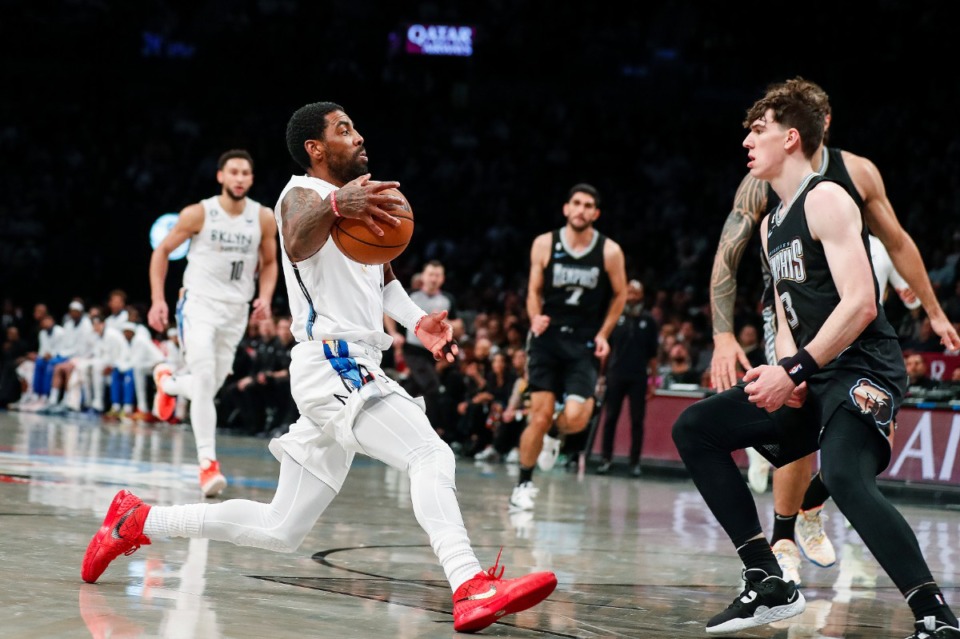 <strong>Memphis Grizzlies forward Jake LaRavia (3) guards Brooklyn Nets guard Kyrie Irving during the first half of an NBA basketball game Sunday, Nov. 20, 2022, in New York.</strong> (Eduardo Munoz Alvarez/AP)