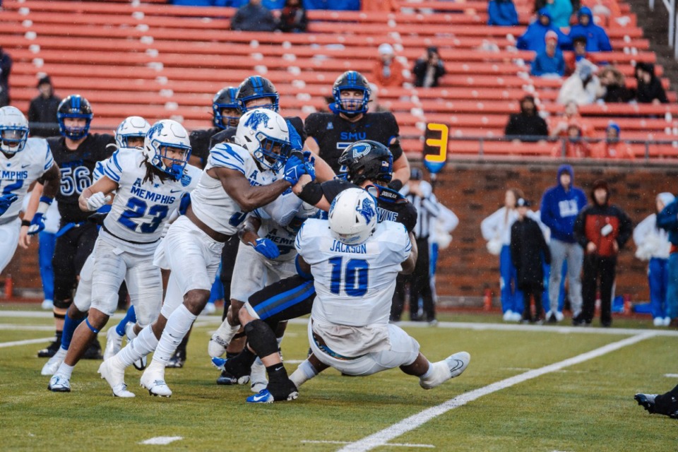 <strong>Cam'Ron Jackson (10) and some Tiger teammates tackle SMU running back Tyler Lavine during the Saturday, Nov. 27, 2022 game at Gerald J. Ford Stadium in Dallas.</strong> (Courtesy Memphis Atletics)