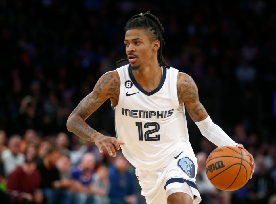 <strong>Memphis Grizzlies guard Ja Morant (12), who finished with a triple-double, dribbles to the basket during the second half of an NBA basketball game against the New York Knicks, Sunday, Nov. 27, 2022, in New York. The Grizzlies won 127-123.</strong> (John Munson/AP)
