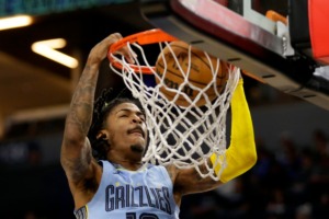 <strong>Memphis Grizzlies guard Ja Morant (12) dunks against the Minnesota Timberwolves on Wednesday, Nov. 30, 2022, in Minneapolis.</strong> (Andy Clayton-King/AP)