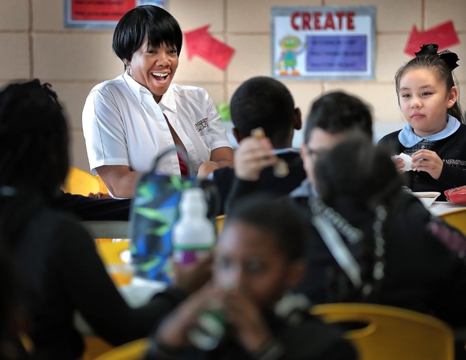 <strong>Memphis Stem Academy principal LaWanda Clark (left) sits with fourth graders during lunch on Jan. 16, 2020. The school was approved to expand to accomodate 300 students.</strong> (Jim Weber/The Daily Memphian)