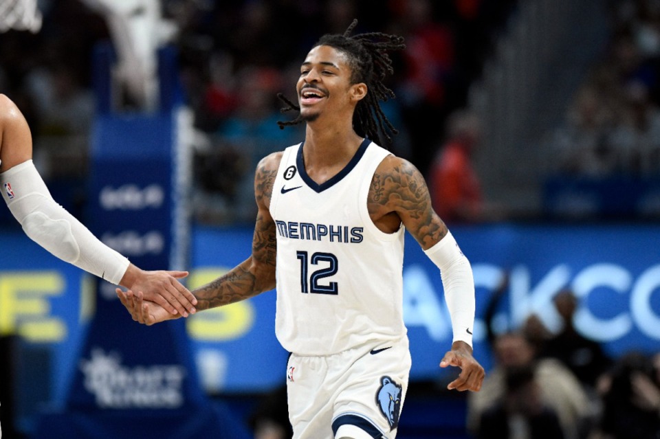 <strong>Memphis Grizzlies guard Ja Morant reacts after dunking against the Detroit Pistons during the second half of an NBA basketball game, Sunday, Dec. 4, 2022, in Detroit.</strong> (Jose Juarez/AP)