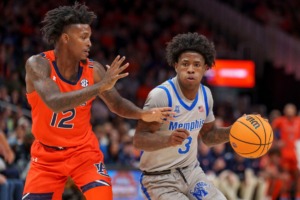 <strong>Memphis guard Kendric Davis (3) drives the ball against Auburn guard Zep Jasper (12) during the second half of an NCAA college basketball game on Saturday, Dec. 10, 2022, in Atlanta.</strong> (Erik Rank/AP)