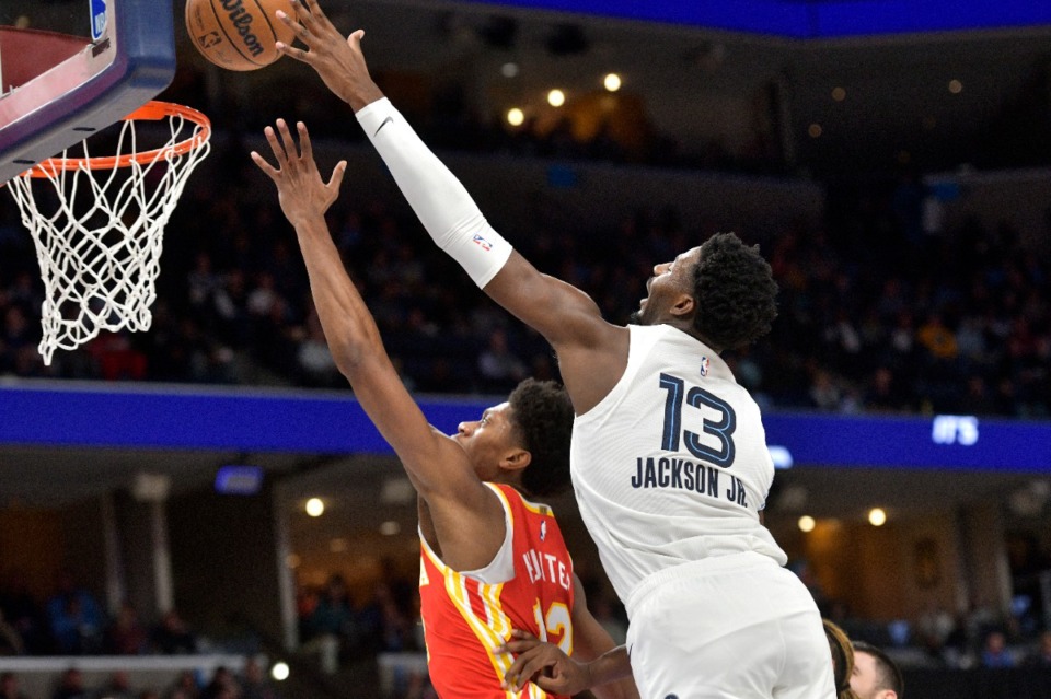 <strong>Memphis Grizzlies forward Jaren Jackson Jr. (13) denies Atlanta Hawks forward De'Andre Hunter on Dec. 12, 2022. Jackson ended the game with a career-high eight blocks.</strong> (Brandon Dill/AP)