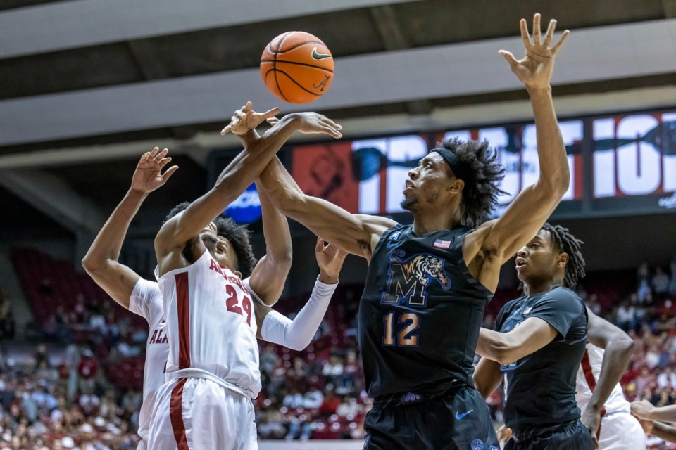 <strong>Memphis forward DeAndre Williams (12) battles Alabama forward Brandon Miller (24) for a rebound during the game in Tuscaloosa. Williams has fouled out three times in 11 games this season.</strong> (AP Photo/Vasha Hunt)