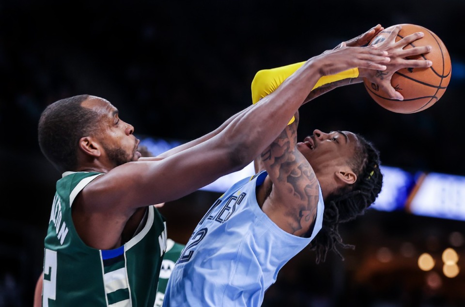 <strong>Memphis Grizzlies Ja Morant (12) gets fouled by Milwaukee&rsquo;s Kris Middleton on Dec. 15, 2022.</strong> (Patrick Lantrip/The Daily Memphian)