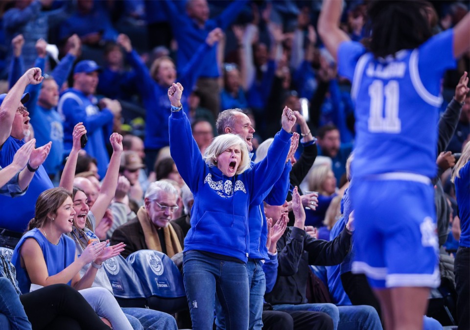 <strong>University of Memphis fans celebrate a Johnathan Lawson (11) three pointer during a Dec. 17, 2022 game against Texas A&amp;M University at FedExForum.</strong> (Patrick Lantrip/The Daily Memphian)