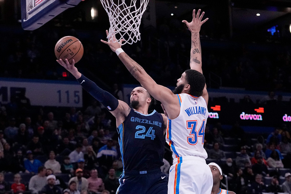 <strong>Memphis Grizzlies forward Dillon Brooks (24) shoots in front of Oklahoma City Thunder forward Kenrich Williams (34) in the second half of an NBA basketball game Saturday, Dec. 17, 2022, in Oklahoma City.</strong> (AP Photo/Sue Ogrocki)