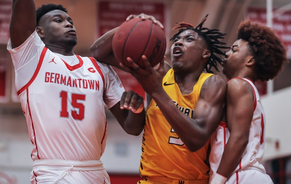 <strong>Whitehaven guard Julius Thedford (5) tries to cut through the Germantown defense during a Dec. 9, 2022 game.</strong> (Patrick Lantrip/The Daily Memphian)