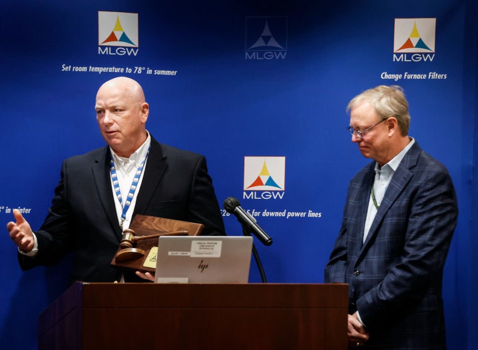 <strong>New Memphis, Light, Gas and Water President Doug McGowen (left) honors Commission Chairman Mitch Graves (right) during his first commission meeting on Wednesday, Dec. 21, 2022.</strong> (Mark Weber/The Daily Memphian)