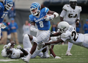 <strong>University of Memphis running back Darrell Henderson (8) breaks a tackle on a run as the Tigers play UCF at Liberty Bowl Memorial Stadium on Oct. 13, 2018. The Los Angeles Rams selected Henderson with the No. 70 pick in the third round of the NFL Draft.</strong> (Jim Weber/Daily Memphian file)