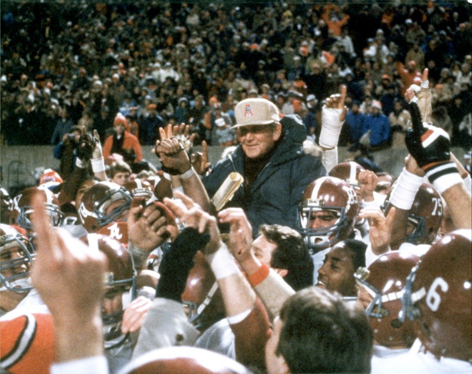 <strong>University of Alabama head football coach Paul &ldquo;Bear&rdquo; Bryant is lifted onto the shoulders of his players after Alabama defeated Illinois 21-15 in the Liberty Bowl on Dec. 29, 1982.</strong> (Tannen Maury/AP file)