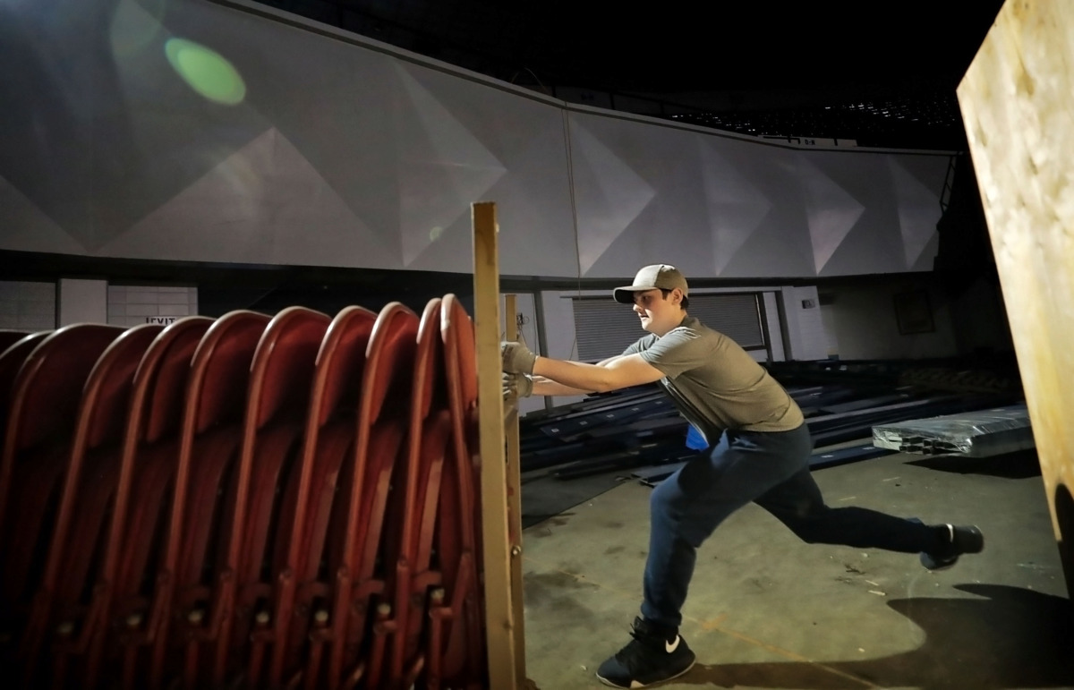 <strong>Brian George shifts a rack of folding chairs at the Mid-South Coliseum on Saturday, April 27, 2019. The volunteer effort, aimed at cleaning up the arena, was arranged by Coliseum Coalition and Clean Memphis.</strong> (Jim Weber/Daily Memphian)