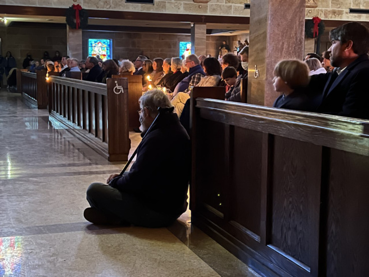 <strong>Despite a rolling blackout, the Christmas Eve Mass was so crowded some worshipers sat on the floor at St. Michael Caholic Church at 3863 Summer Ave.</strong> (Karen Focht/Special to The Daily Memphian)