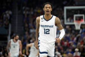 <strong>Memphis Grizzlies guard Ja Morant reacts after scoring against the Golden State Warriors during the first half of an NBA basketball game in San Francisco, Sunday, Dec. 25, 2022.</strong> (AP Photo/Godofredo A. V&aacute;squez)