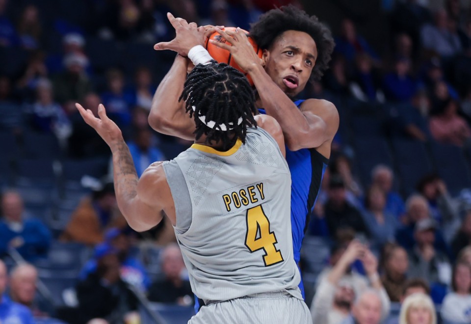 <strong>University of Memphis forward Deandre Williams (12) grabs a loose rebound during a Dec. 21, 2022 game against Alabama State University.</strong> (Patrick Lantrip/The Daily Memphian)