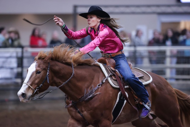 <strong>A rider kicks her mount into high gear in the barrel-racing competition at the 2022 AutoZone Liberty Bowl Professional Rodeo on Dec. 26, 2022.</strong> (Patrick Lantrip/The Daily Memphian)