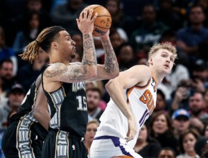 <strong>Memphis Grizzlies forward Brandon Clarke (left) grabs a rebound from Phoenix Suns defender Jock Landale (right) on Tuesday, Dec. 27, 2022.</strong> (Mark Weber/The Daily Memphian)