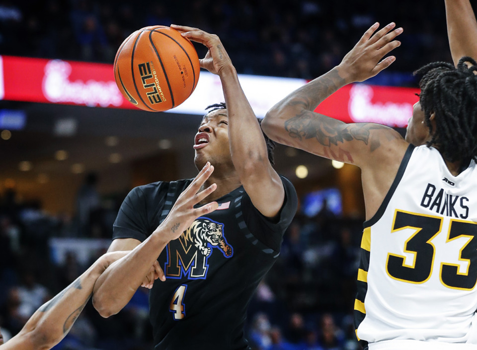 <strong>University of Memphis forward Chandler Lawson (middle) is fouled during action against VCU on Sunday, November 20, 2022.&nbsp;Should Lawson be in the Tigers' starting lineup?&nbsp;</strong>(Mark Weber/The Daily Memphian)