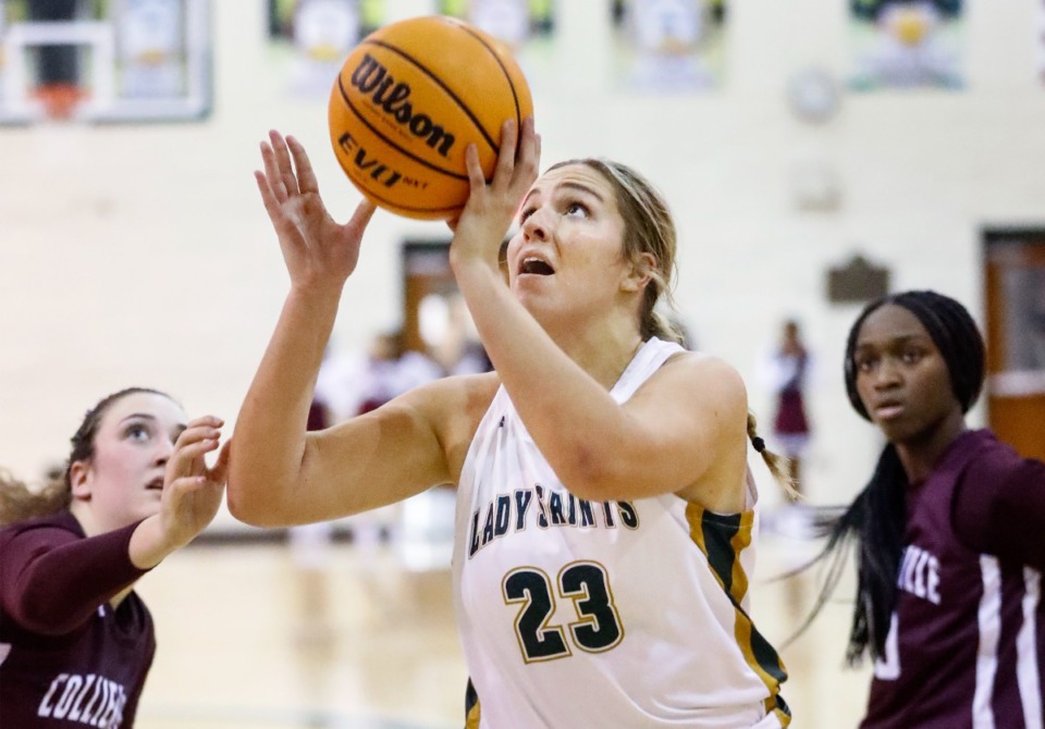 <strong>Briarcrest forward Kayli Clarkson (middle) drives to the basket on Dec. 2, 2022.</strong> (Mark Weber/The Daily Memphian file)