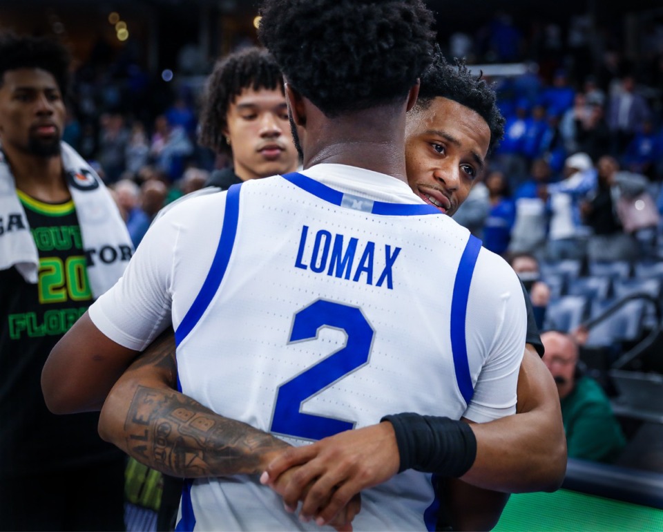<strong>Memphis guard Alex Lomax (2) hugs former teammate and South Florida guard Tyler Harris (2) after the Dec. 29, 2022, game.</strong> (Patrick Lantrip/The Daily Memphian)
