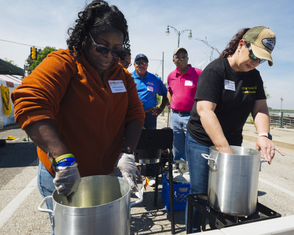 <strong>Rowdy Rouxologist teammates Brenda Davis and Christie Padawer prepare gumbo at the Rajun Cajun Crawfish Festival on Sunday in Downtown Memphis. Rowdy Rouxologist won first place for its gumbo last year at the festival.</strong> (Ziggy Mack/Special to the Daily Memphian)