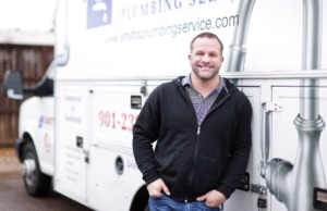 <strong>Dustin Smith, owner of Smith's Plumbing, leans on one of his company's trucks on Dec. 30, 2022. He&rsquo;s&nbsp;&ldquo;booked up,&rdquo; he says.</strong> (Patrick Lantrip/The Daily Memphian)