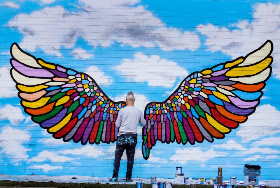<strong>Artist Craig Thompson pains a wing mural on the side of Bartlett United Methodist Church on Friday, Oct. 21, 2022.</strong> (Mark Weber/The Daily Memphian)